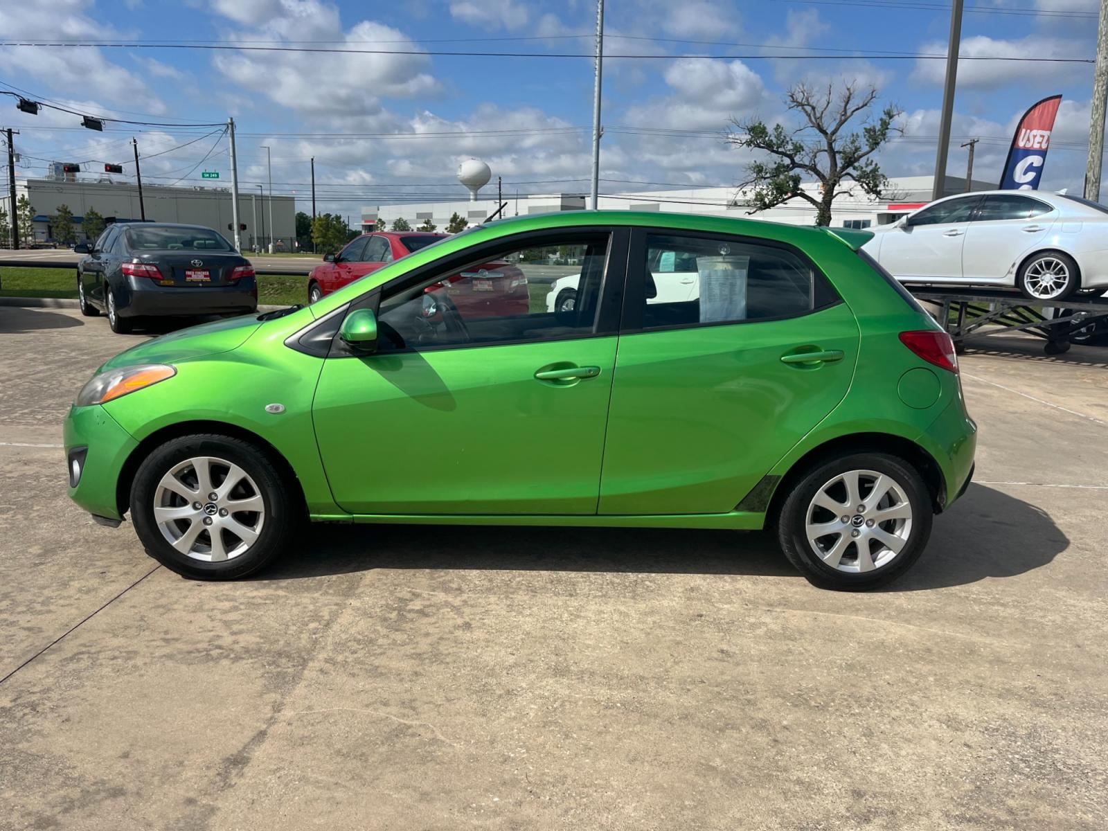2013 green /black Mazda MAZDA2 Touring (JM1DE1LY1D0) with an 1.5L L4 DOHC 16V engine, Automatic transmission, located at 14700 Tomball Parkway 249, Houston, TX, 77086, (281) 444-2200, 29.928619, -95.504074 - Photo #3